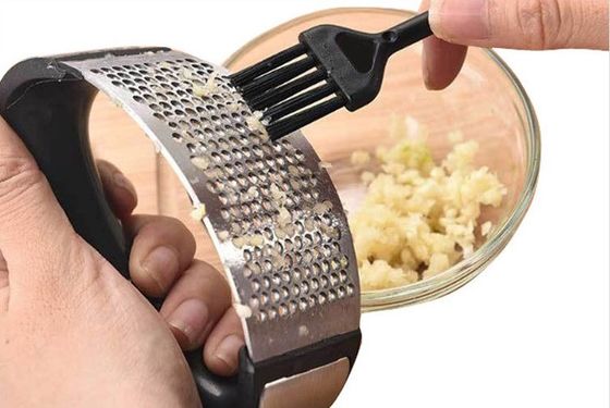 Best seller Hot Garlic Press Peeler Manuale in acciaio inossidabile per utensili per frutta e verdura